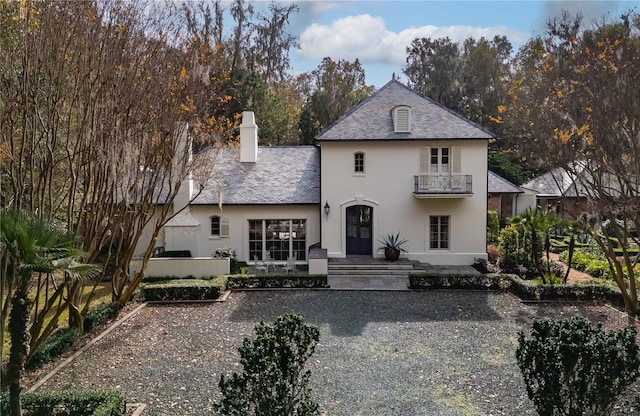 view of front of home with a balcony