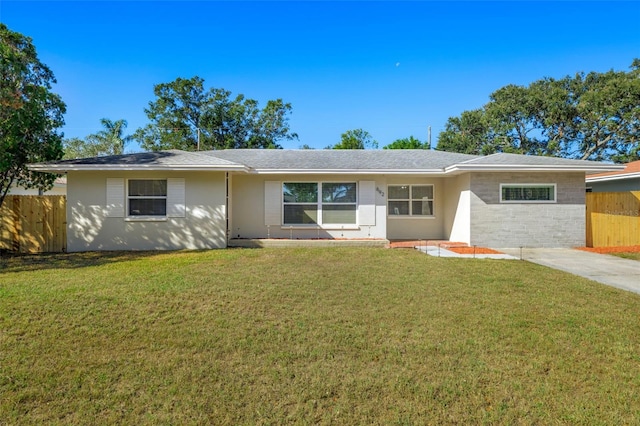 ranch-style house featuring a front lawn