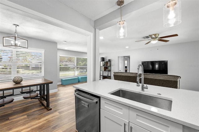 kitchen with white cabinetry, dishwasher, sink, dark hardwood / wood-style floors, and pendant lighting