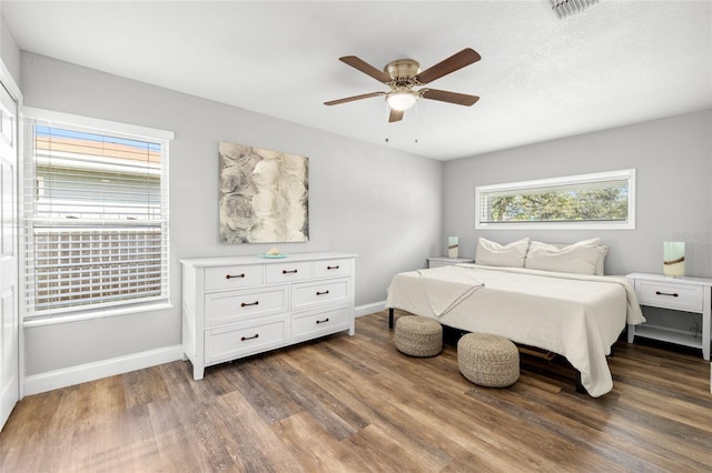 bedroom featuring dark hardwood / wood-style floors and ceiling fan