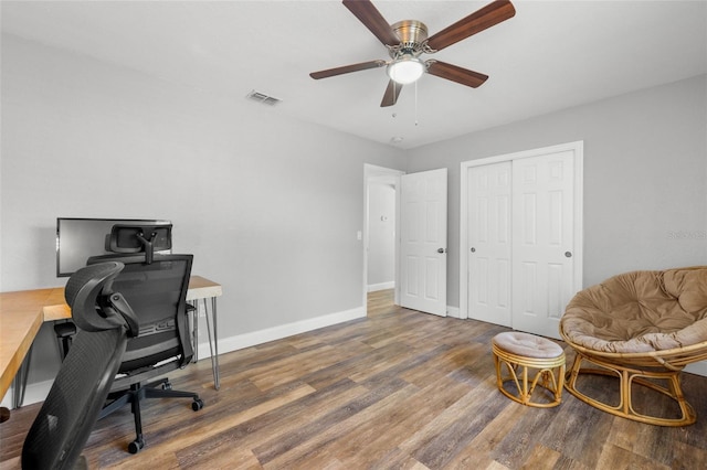 home office featuring ceiling fan and dark hardwood / wood-style flooring