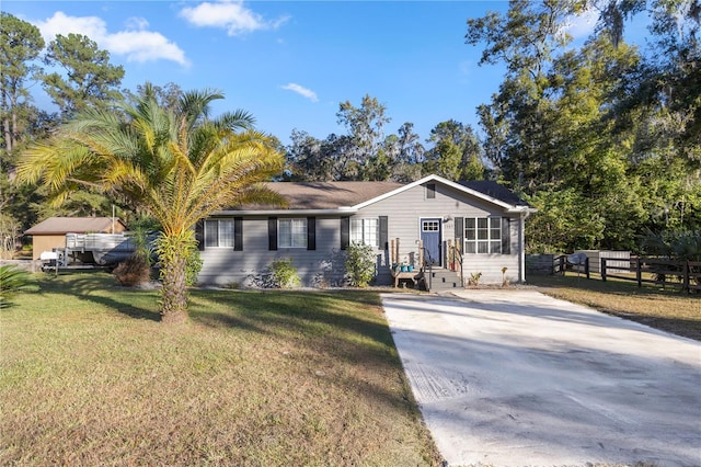 ranch-style house with a front yard