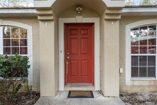 20390 SW 57th St, Dunnellon, FL 34431 - view of exterior entry with stucco siding
