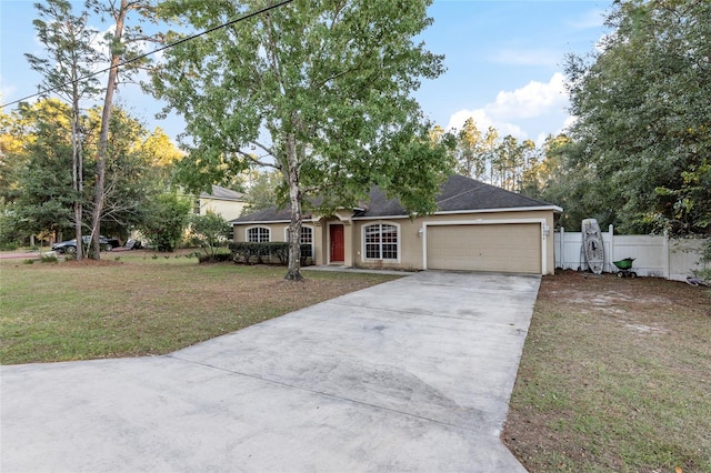 ranch-style home with a garage and a front lawn