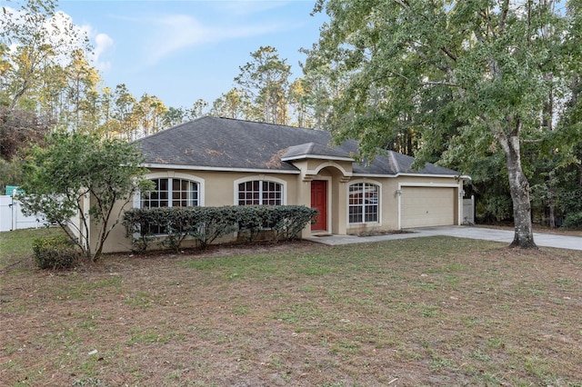 ranch-style house with a front lawn and a garage