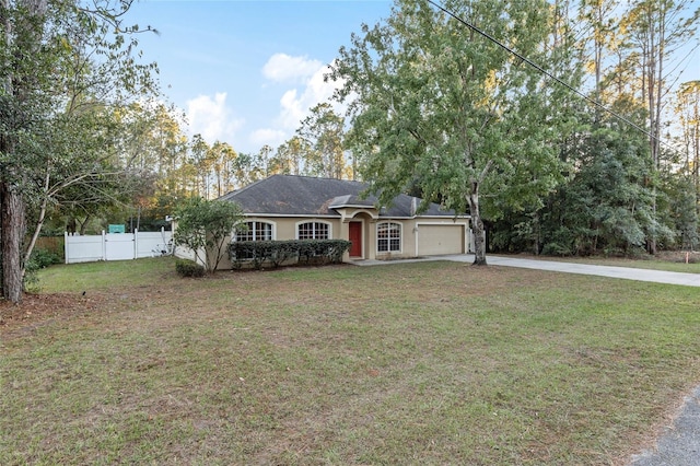 ranch-style home featuring a front yard and a garage