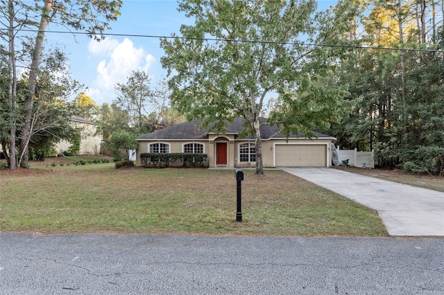 20390 SW 57th St, Dunnellon, FL 34431 - ranch-style house featuring a garage, concrete driveway, stucco siding, and a shingled roof