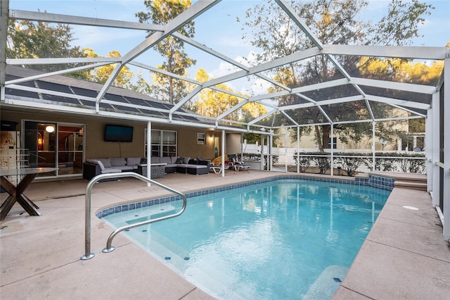 view of pool with an outdoor living space, a lanai, and a patio