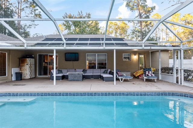 rear view of property featuring an outdoor living space, a lanai, and a patio area