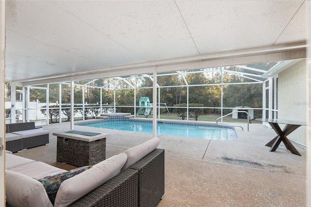 20390 SW 57th St, Dunnellon, FL 34431 - outdoor pool with an outdoor living space, a patio area, and glass enclosure