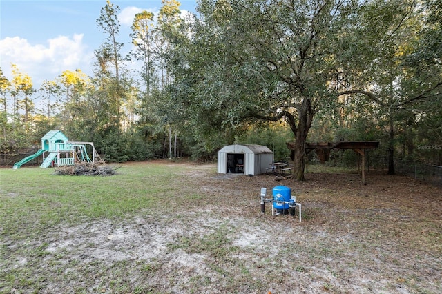 view of yard featuring a shed and a playground