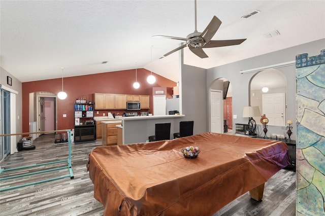 playroom featuring ceiling fan, billiards, light hardwood / wood-style floors, a textured ceiling, and lofted ceiling