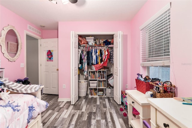 20390 SW 57th St, Dunnellon, FL 34431 - bedroom featuring wood finished floors, a closet, and baseboards