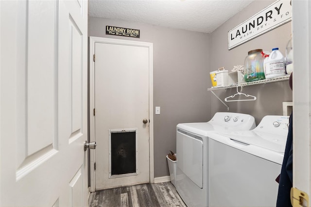 20390 SW 57th St, Dunnellon, FL 34431 - laundry room with washing machine and clothes dryer, wood finished floors, a textured ceiling, and baseboards