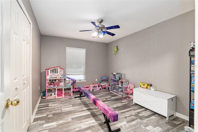 20390 SW 57th St, Dunnellon, FL 34431 - rec room featuring wood finished floors, ceiling fan, and baseboards