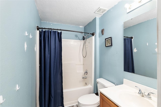 20390 SW 57th St, Dunnellon, FL 34431 - bathroom with vanity, toilet, a textured ceiling, and shower / bath combo with shower curtain