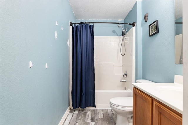 20390 SW 57th St, Dunnellon, FL 34431 - bathroom with wood finished floors, shower / bathtub combination with curtain, vanity, toilet, and a textured ceiling