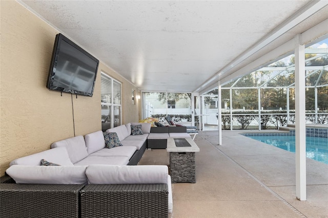 view of patio / terrace with outdoor lounge area, a lanai, and a fenced in pool