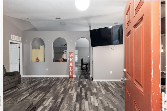 20390 SW 57th St, Dunnellon, FL 34431 - living room featuring dark wood-style floors, baseboards, and vaulted ceiling
