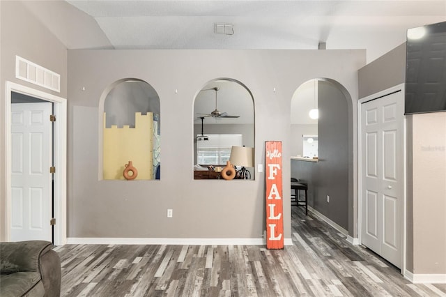 20390 SW 57th St, Dunnellon, FL 34431 - living area featuring wood finished floors, ceiling fan, and baseboards