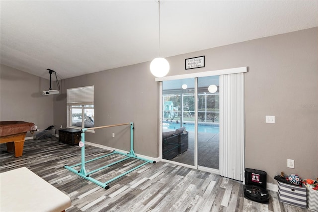 20390 SW 57th St, Dunnellon, FL 34431 - rec room featuring wood finished floors, pool table, baseboards, and lofted ceiling