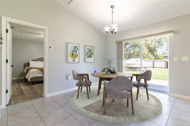 17023 SW 41st Avenue Rd, Ocala, FL 34473 - dining area featuring light tile patterned floors, a chandelier, and vaulted ceiling