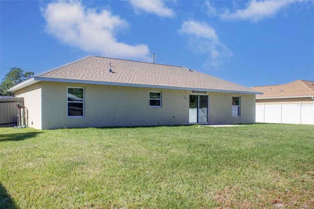 17023 SW 41st Avenue Rd, Ocala, FL 34473 - back of property with a yard