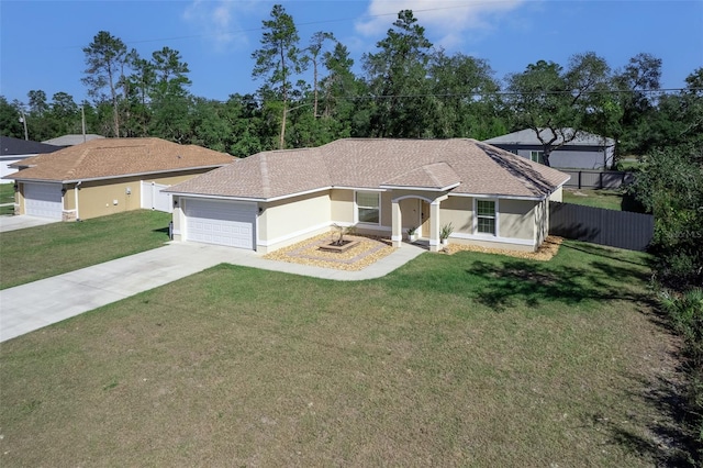 17023 SW 41st Avenue Rd, Ocala, FL 34473 - view of front of house with a garage and a front lawn