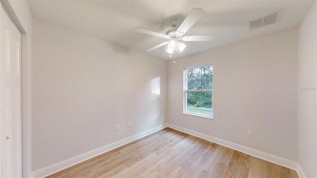 empty room featuring ceiling fan and light hardwood / wood-style flooring