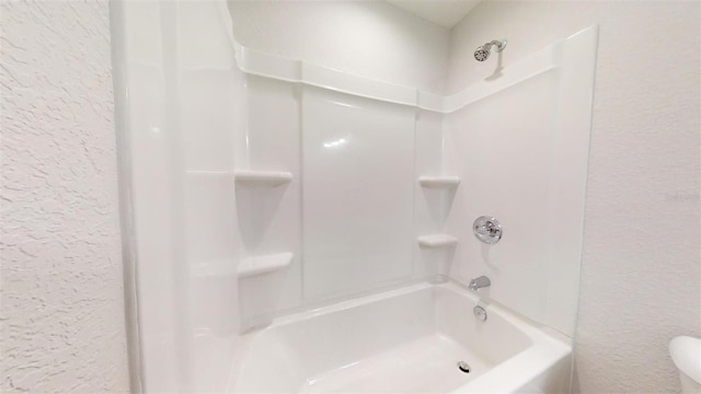 bathroom with shower / bath combination