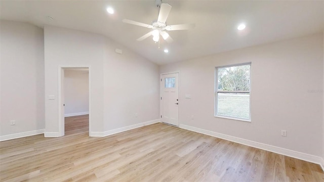 spare room with ceiling fan, light hardwood / wood-style floors, and lofted ceiling