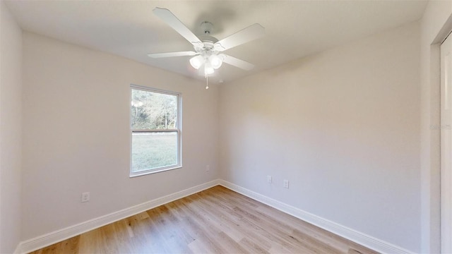 spare room featuring ceiling fan and light hardwood / wood-style flooring