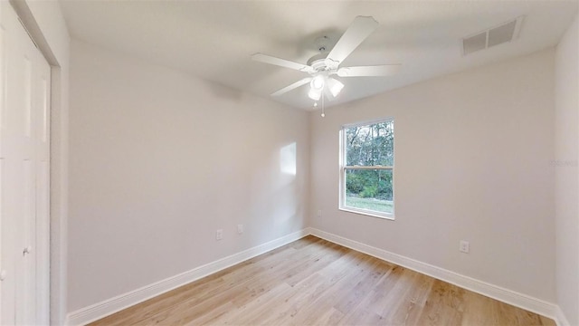 spare room featuring ceiling fan and light hardwood / wood-style flooring