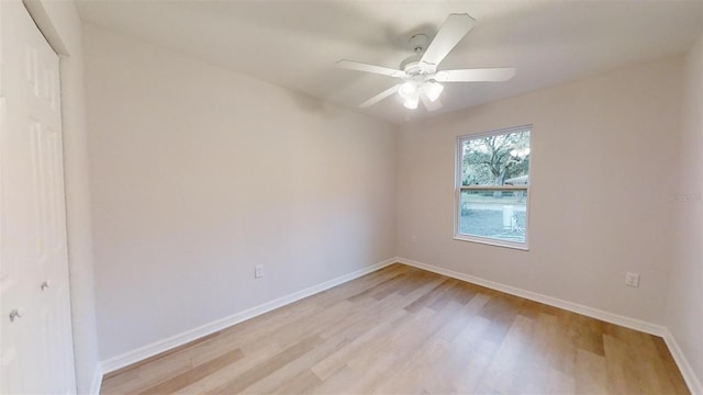 spare room with light hardwood / wood-style floors and ceiling fan