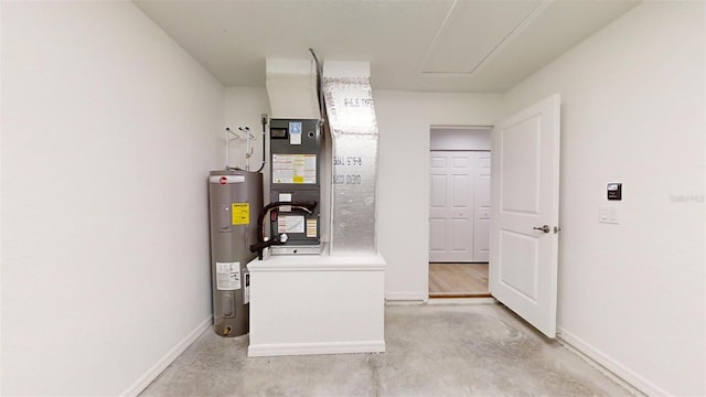 utility room with electric water heater