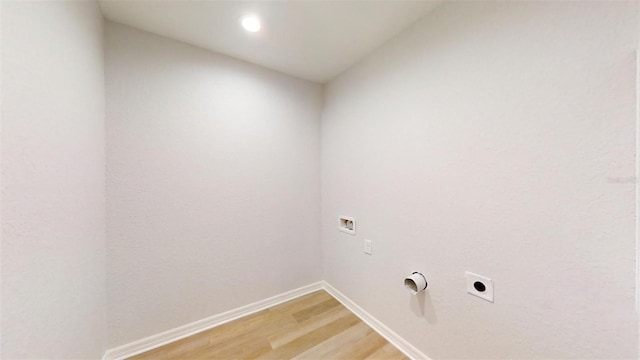 laundry room featuring electric dryer hookup, hardwood / wood-style floors, and hookup for a washing machine