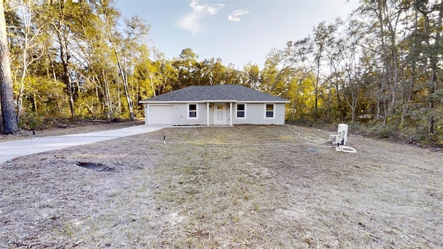 single story home featuring a garage