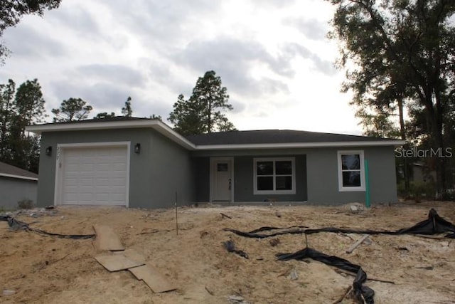 ranch-style house featuring a garage