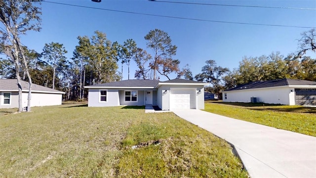 single story home with a garage and a front yard