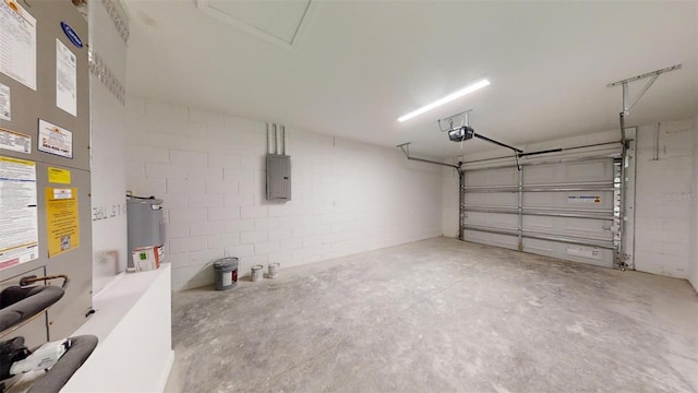 garage with a garage door opener, electric panel, and water heater