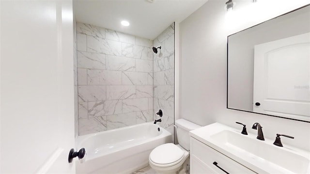 full bathroom with tiled shower / bath combo, vanity, and toilet