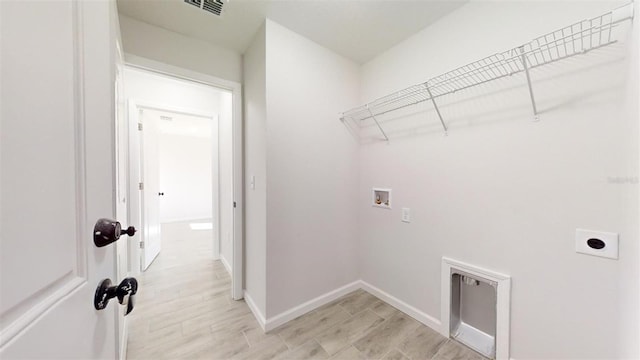 laundry area with washer hookup and electric dryer hookup