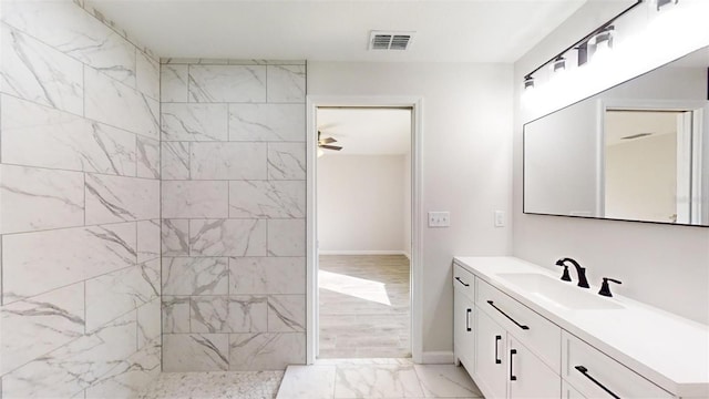 bathroom featuring vanity and ceiling fan