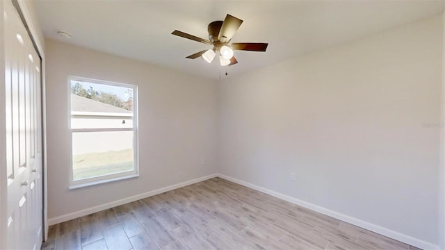 unfurnished room with ceiling fan and light hardwood / wood-style floors