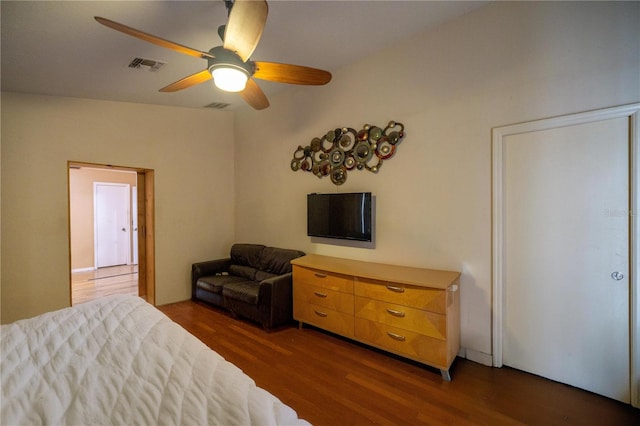 bedroom featuring ceiling fan and dark wood-type flooring