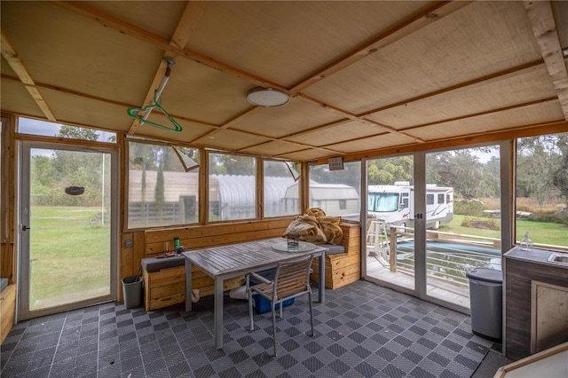 sunroom / solarium featuring plenty of natural light