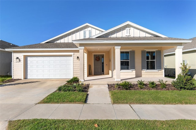 view of front of property with a garage and a porch