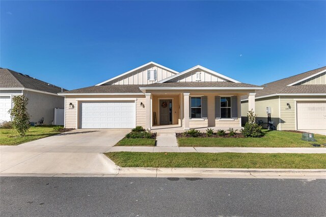 view of front of property with a garage and covered porch