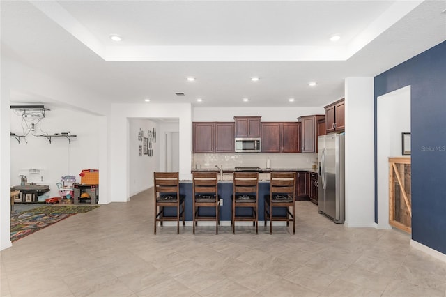 dining room with a tray ceiling