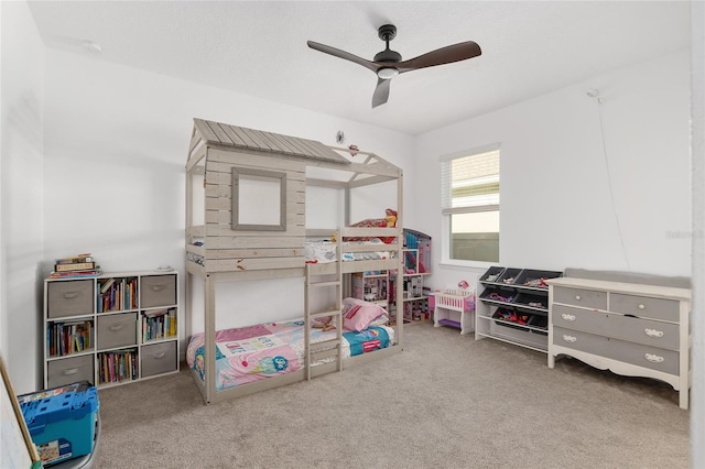 bedroom featuring ceiling fan and carpet floors